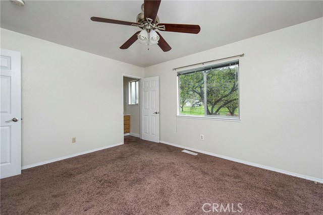 Master bedroom with beautiful views to backyard and pond beyond