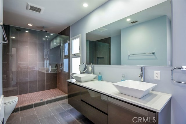 The master bath is a spa in your own home. Cool and contemporary finishes make this a relaxing extension to the master suite.