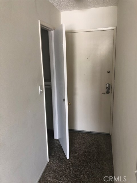 Walk-in closet near unit entrance