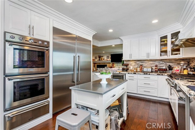 Thermador Oven, Warming tray, built-in refrigerator and wine frig make this a perfect chef's kitchen to entertain.