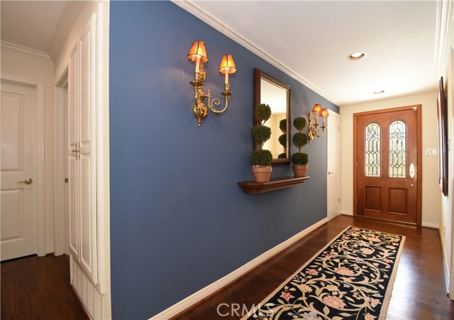 Formal entry features cedar lined coat closet.