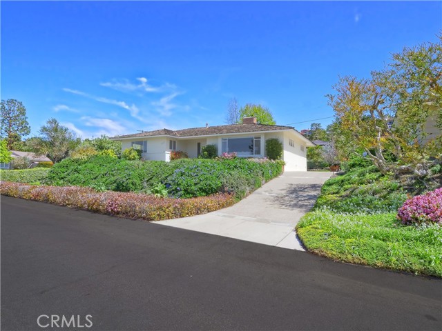 Nicely paved driveway leads to private garage