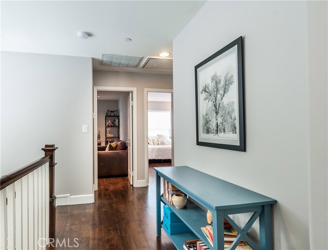 The second floor hallway leads to two additional bedrooms, plus hall bath.