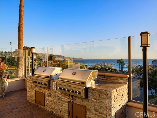 Local pool is steps away....all set with fire pit, plenty of tables, chairs, lounges and yes....newly remodeled dual Grills....LOOK at that VIEW!!!