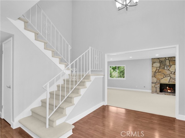 Entry flows to living-dining room (fire is photographer's graphic insertion, not real) Entry flows to living-dining room (fire is photographer's graphic insertion, not real)