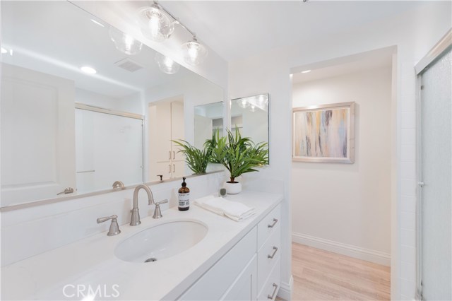 Second bathroom with elegant quartz counters and self closing doors and drawers