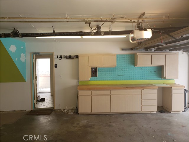 Direct Access Garage. Built-in Workbench and Cabinetry.