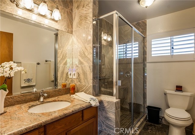 This completely remodeled 3/4 bathroom is located off the Family Room on the 1st level.