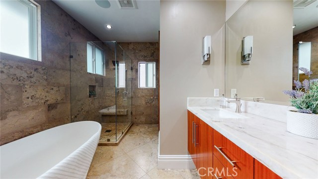 Upstairs Master Bathroom with MTI Stone Soaking Tub and Natural Quartz Counter top with dual sinks.