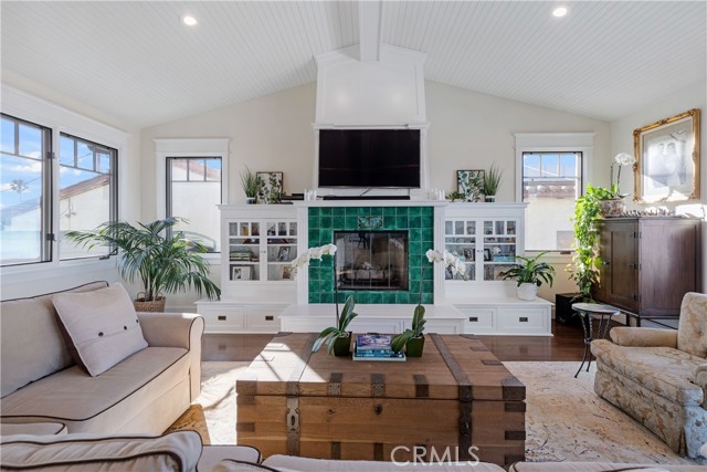 Such a beautiful space with fireplace focal point and handsome built-in cabinetry