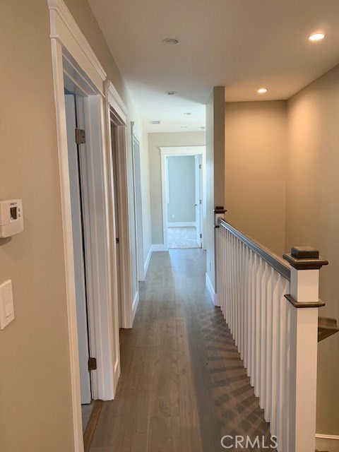 Upstairs hallway leading to upstairs bedrooms and laundry room.
