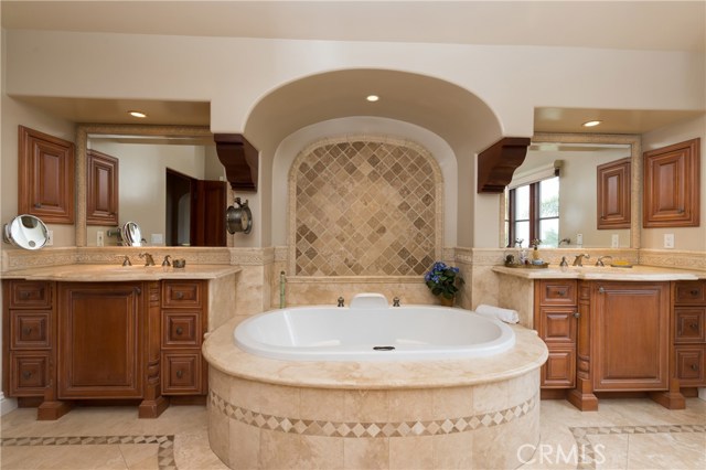 Huge master bathroom with his and her vanities, and large soaking tub