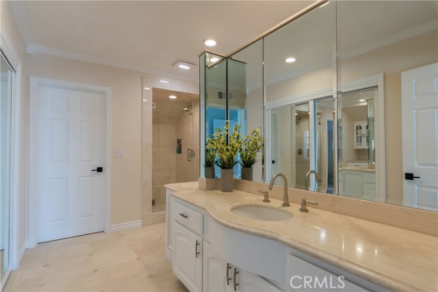 Huge remodeled master bath has separate back to back his & her huge sink areas + separate giant walk-in closets!
