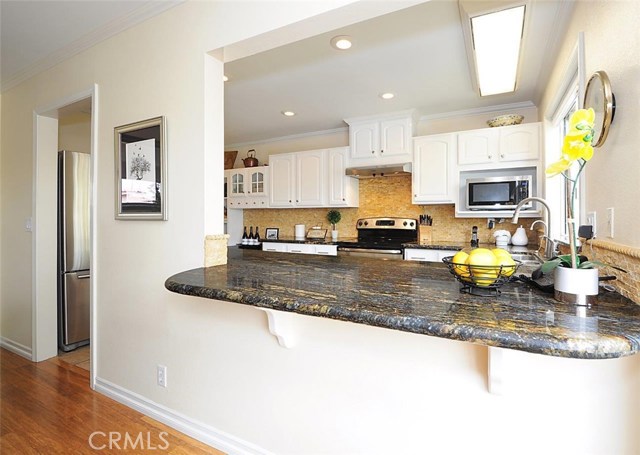 Open concept kitchen with pass through/bar from Dining area.