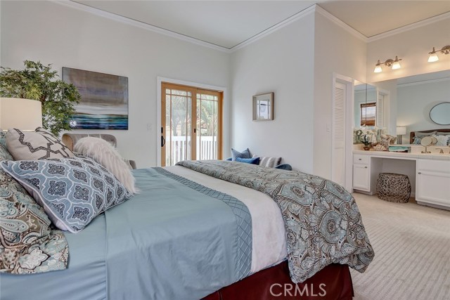 Master bedroom with large custom built in vanity.