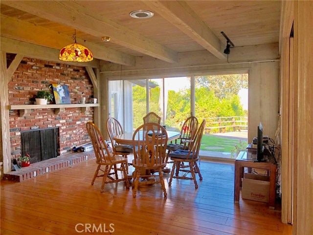 Family Room with Second Feature Fireplace and Direct Access out to Covered Patio and View Deck.