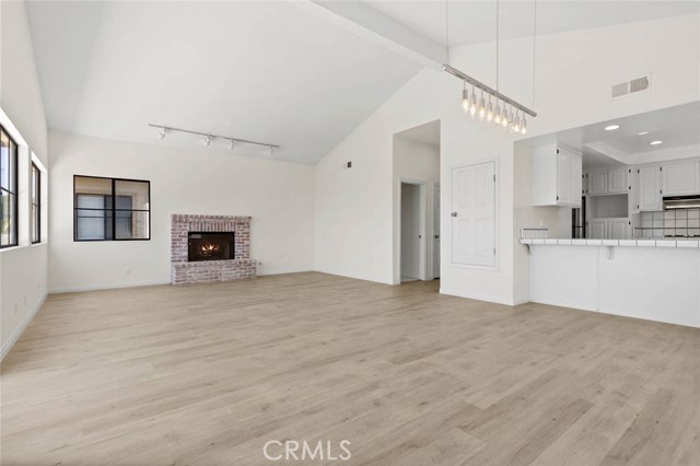 Spacious Family room with high ceilings and fireplace