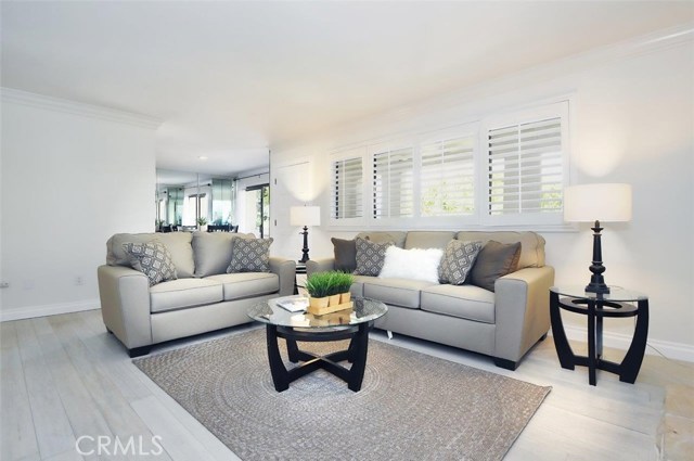 Plantation shutters and bamboo wood floors can be found throughout this beautifully upgraded unit.