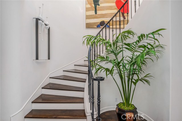 Winding Staircase Illuminated by the Upstairs Skylight