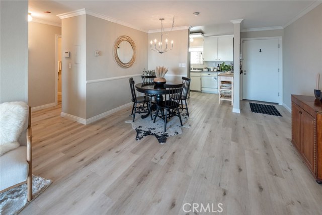 The wood floors are found throughout the living, dining, kitchen and hallway areas.