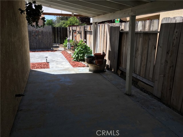 Inviting covered concrete patio off the Bonus Room