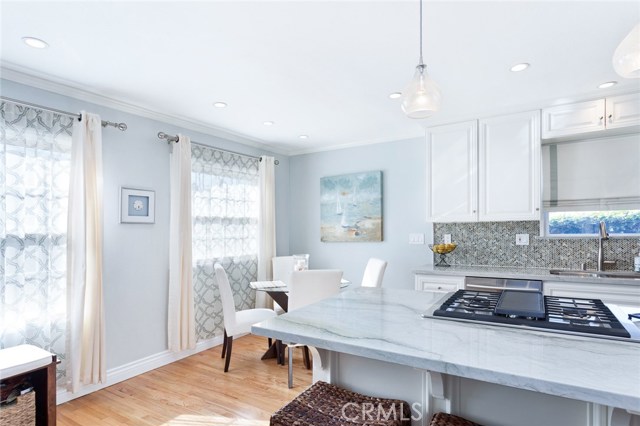 Gorgeous quartz slab, crown molding, baseboards and new lighting.