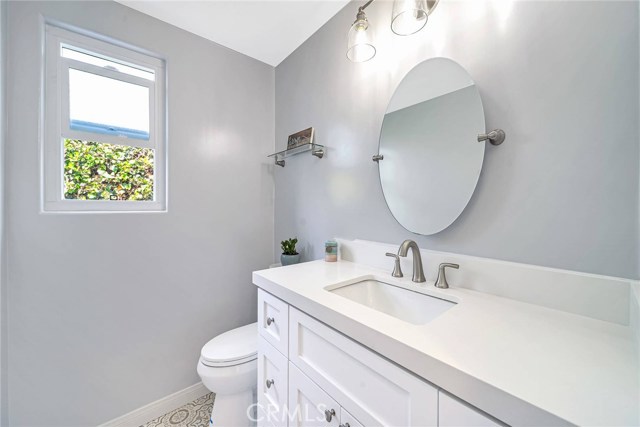 Remodeled half bathroom for guests next to the first floor bedroom.