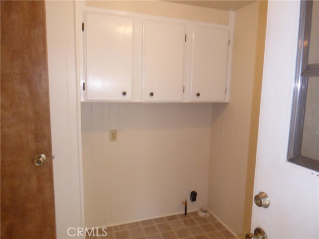 Laundry room with 220V and Gas Dryer hook ups. New flooring.