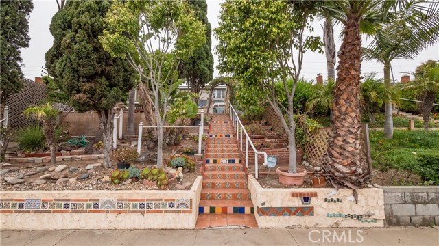Staircase to yard and front entry door
