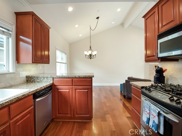 Chef’s kitchen that features stainless steel appliances