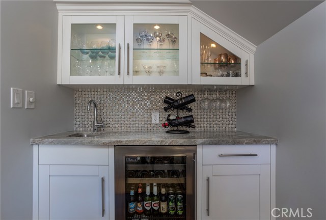 Wet bar with custom cabinets and Perlick Fridge in Dining area.
