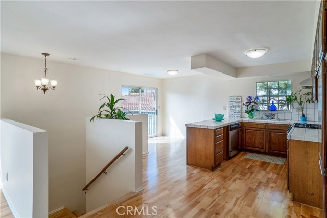 BACK HOUSE: OPEN KITCHEN WITH DINING AREA AND LARGE PATIO.