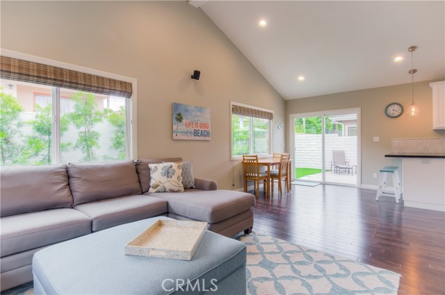 Family room with eating area off kitchen and breakfast bar.