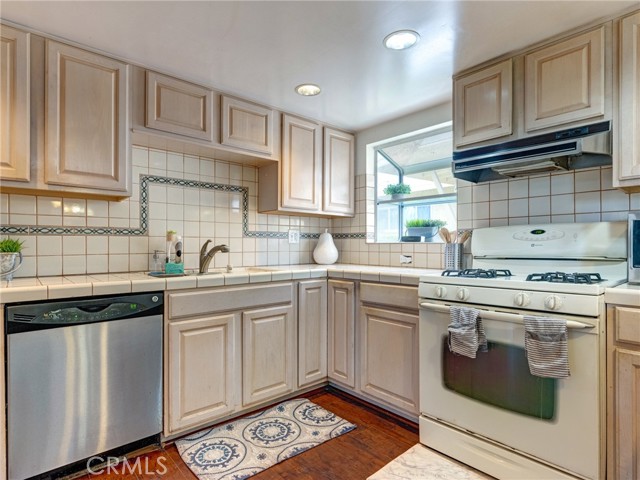 Kitchen comes fully equipped with 4 burner range, gas stove, dishwasher, and garbage disposal.