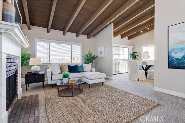 The living room is open to the dining area and kitchen, ideal for entertaining!