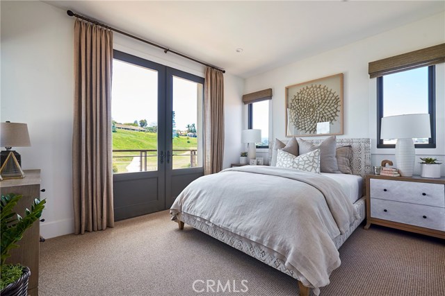 Upstairs guest suite with balcony, French doors, private bathroom & walk-in closet.