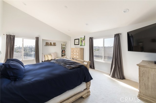 vaulted ceilings in master bedroom and tons of natural light