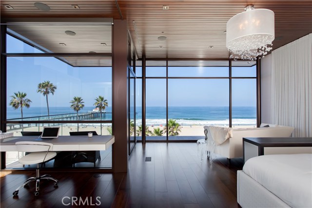 Private master suite with floor to ceiling windows, integrated office and unparalleled ocean and beach vistas.