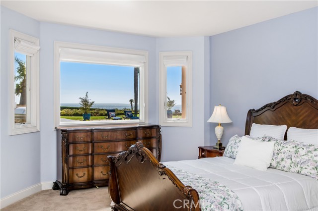 Bedroom 5 with gorgeous bay windows and pool and ocean view. Walk in closet and ensuite bath