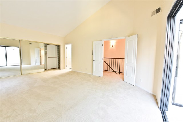 Master bedroom with french doors, large wall to wall closets, and a private full bath