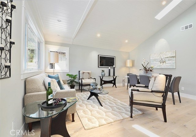 Vaulted ceiling in living room with skylights