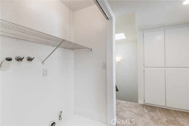 Upstairs laundry area and linen closets