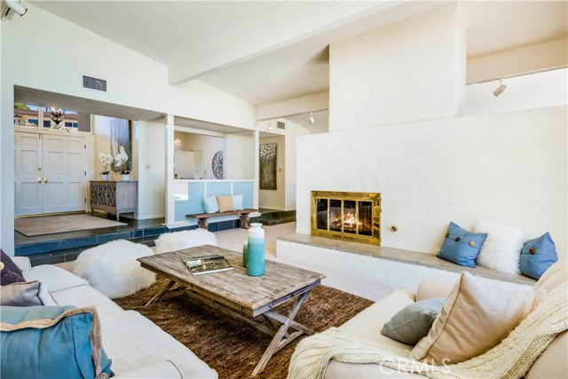 Living room with fireplace and view