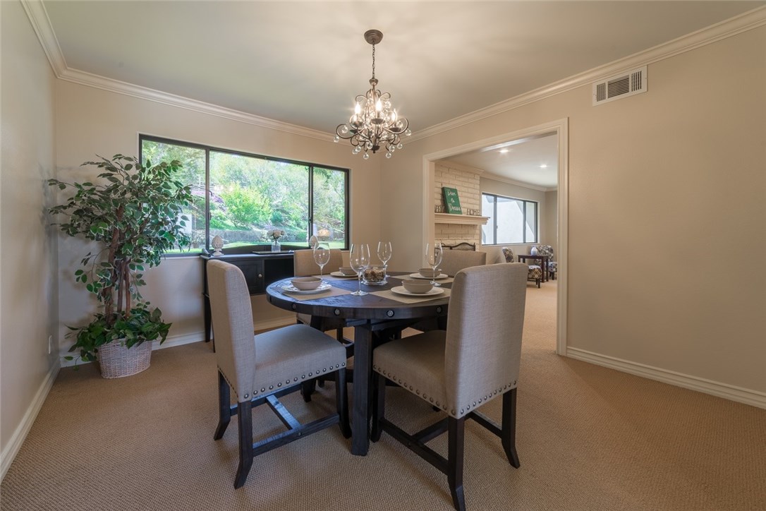 Dine in style in your formal living with a gorgeous view of your garden backyard too...