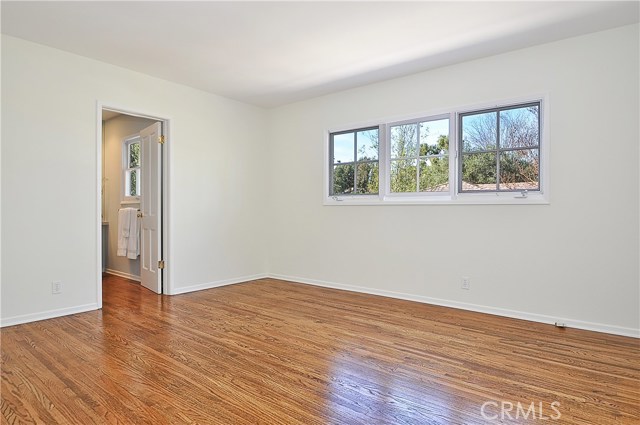 Spacious Bedroom Leading to Bathroom