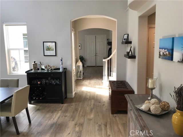 Hallway linking entry area, bonus room, dining room, and family room