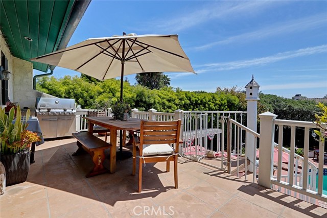 patio off of kitchen. Views of neighborhood and trees