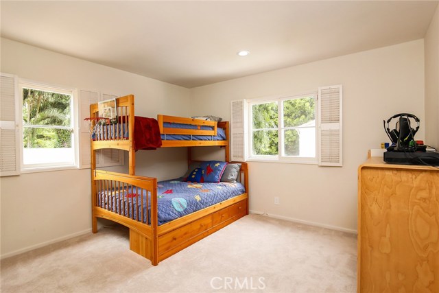 Spacious bedroom overlooking the backyard