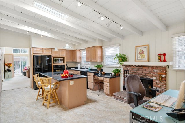 Eat in kitchen with sky lights, raised hearth fire place, cooks island and home work station. DEEP cabinets and plenty of storage