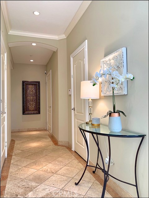 The elegant detail in the home can be found throughout - entry level hallway leading to bedrooms 2 and 3, laundry room and backyard.